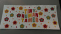 Tiny Human Tamer, colorful smiley face flowers