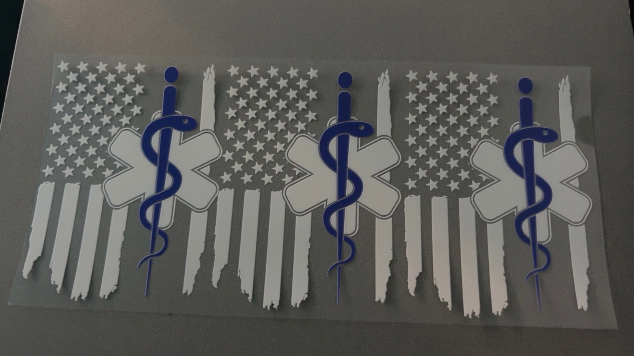 EMT logo with white flags
