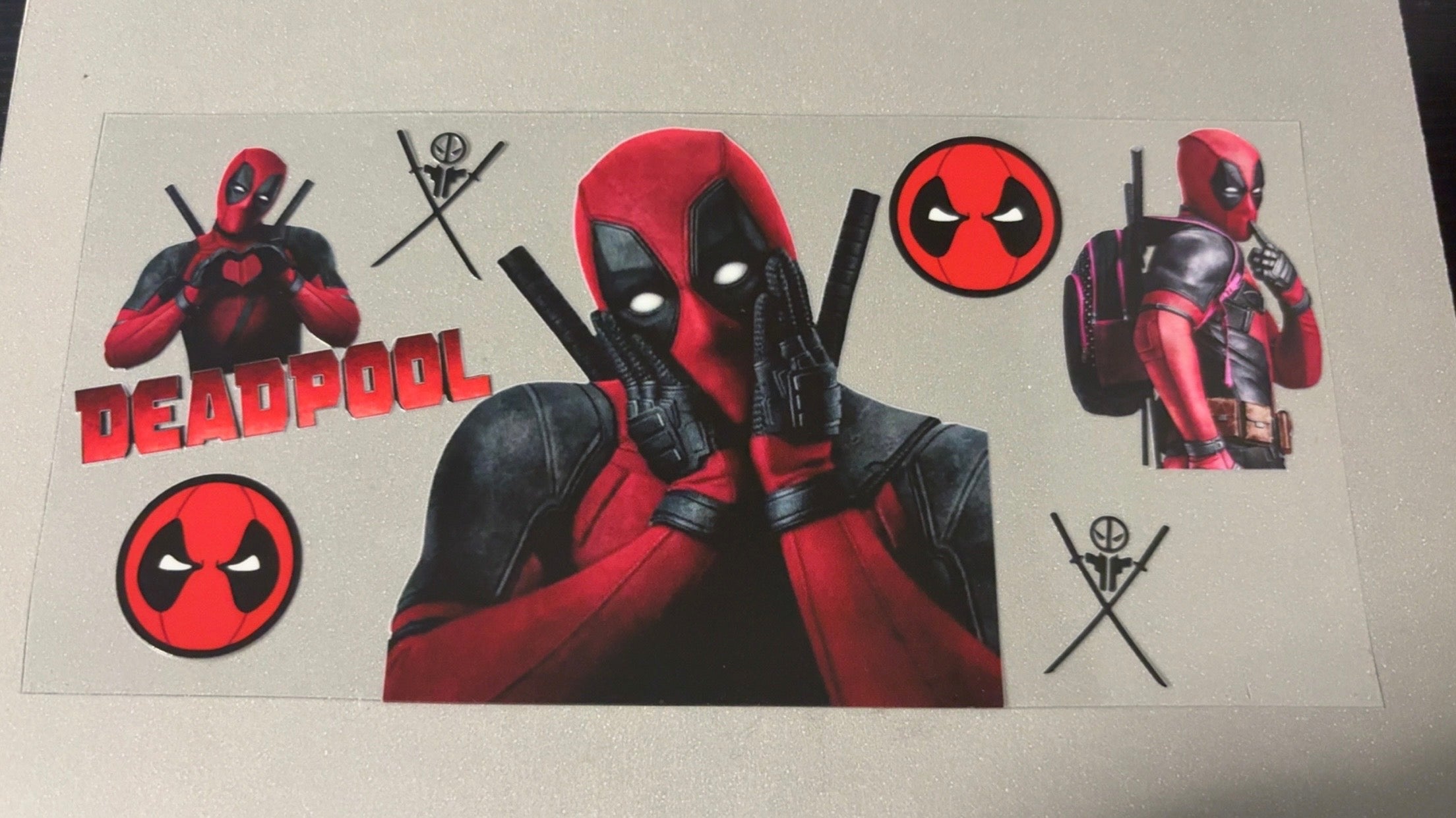 Deadpool holding face
