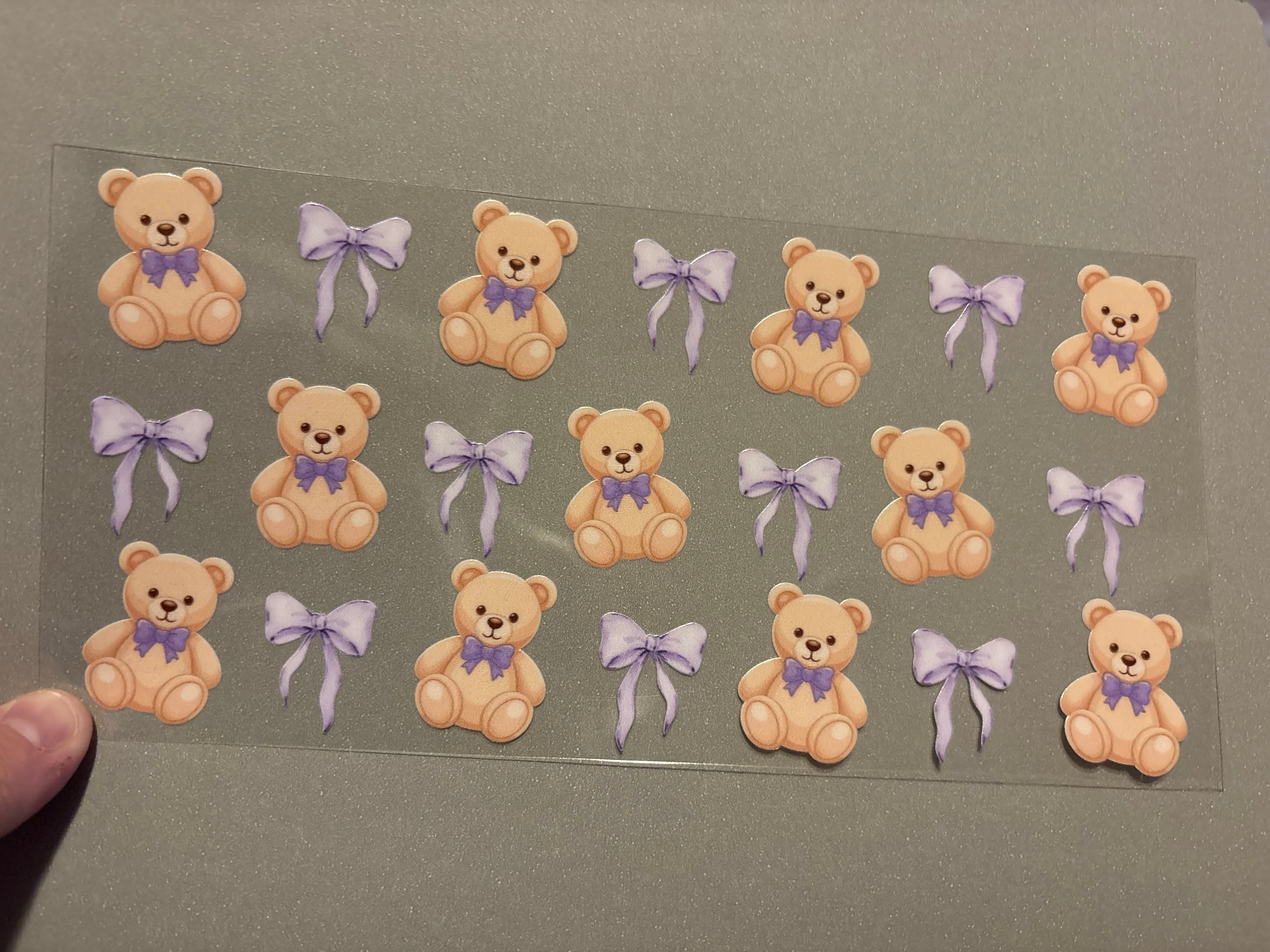 Teddy bears with purple bows