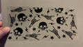Skull hands, skull heads & lightning