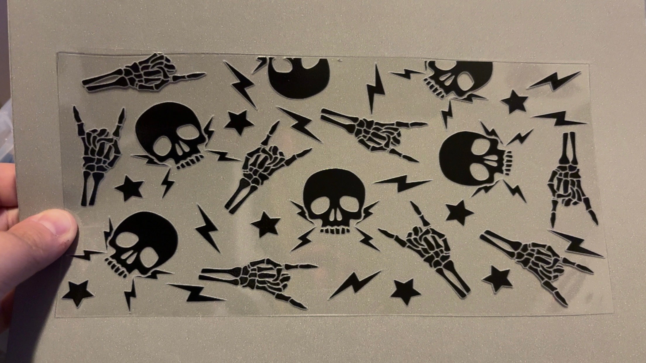 Skull hands, skull heads & lightning