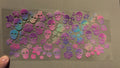 Pink, purple, green, blue, yellow skulls & flowers