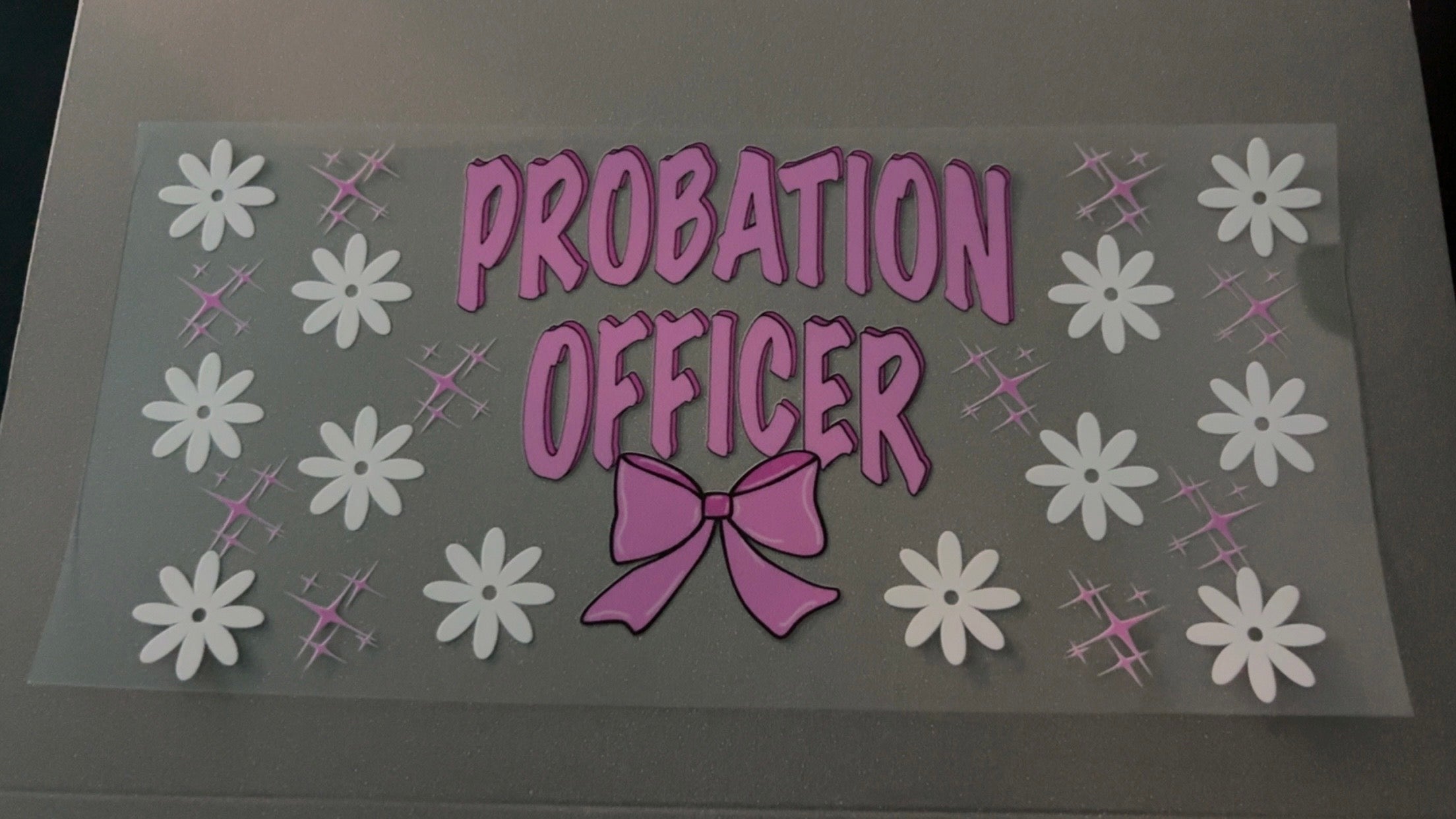 Probation Officer, pink bow, white flowers, pink sparkles