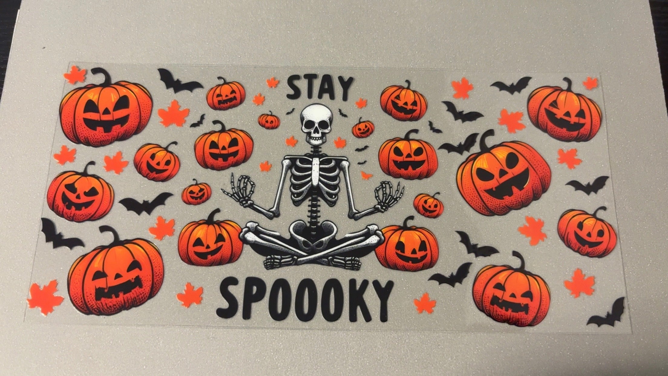 Stay Spooky, skeleton sitting criss cross,pumpkins, bats