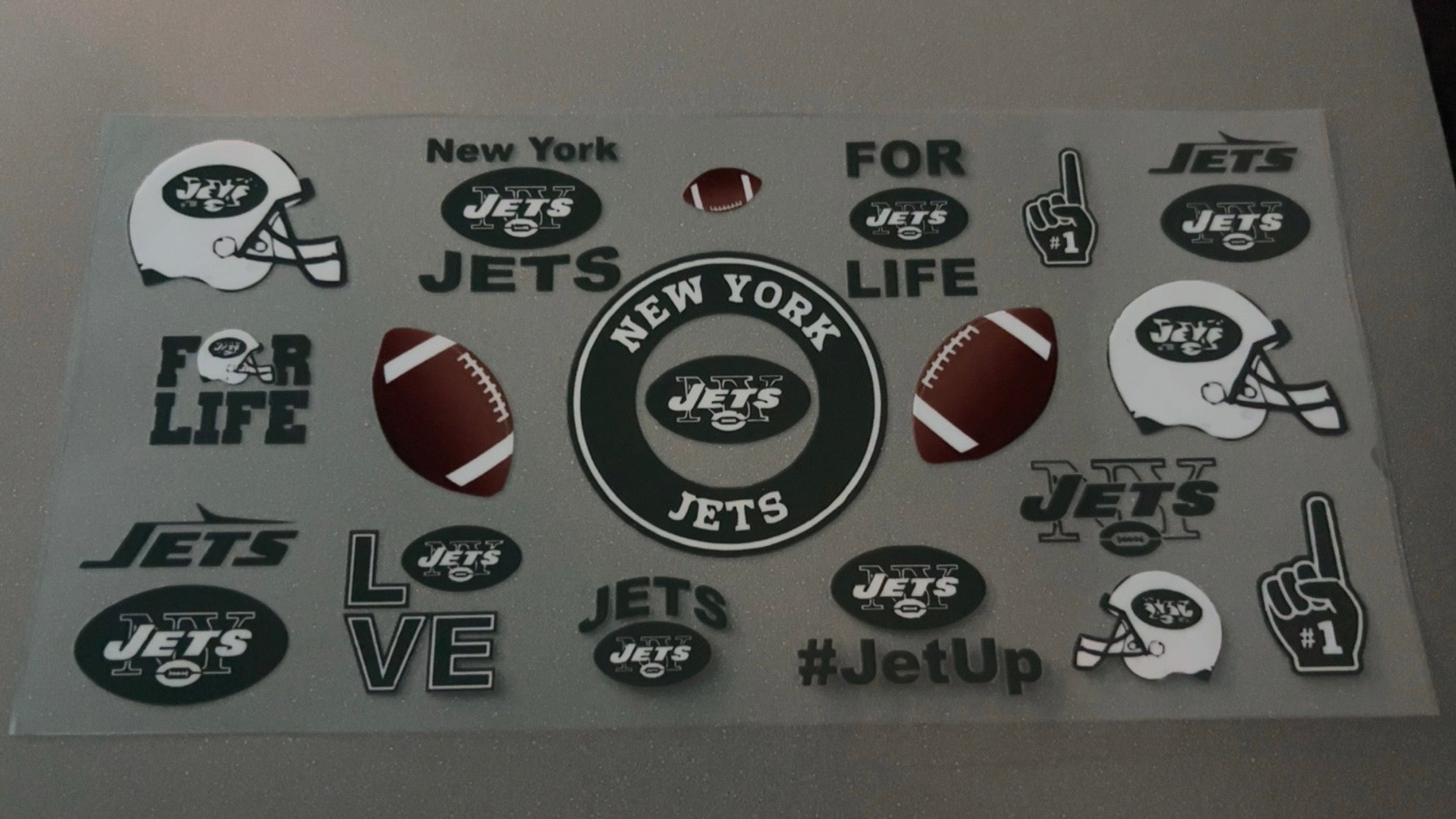 New York Jets with logo, helmets & footballs