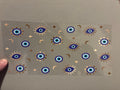 Small evil eye, gold moons