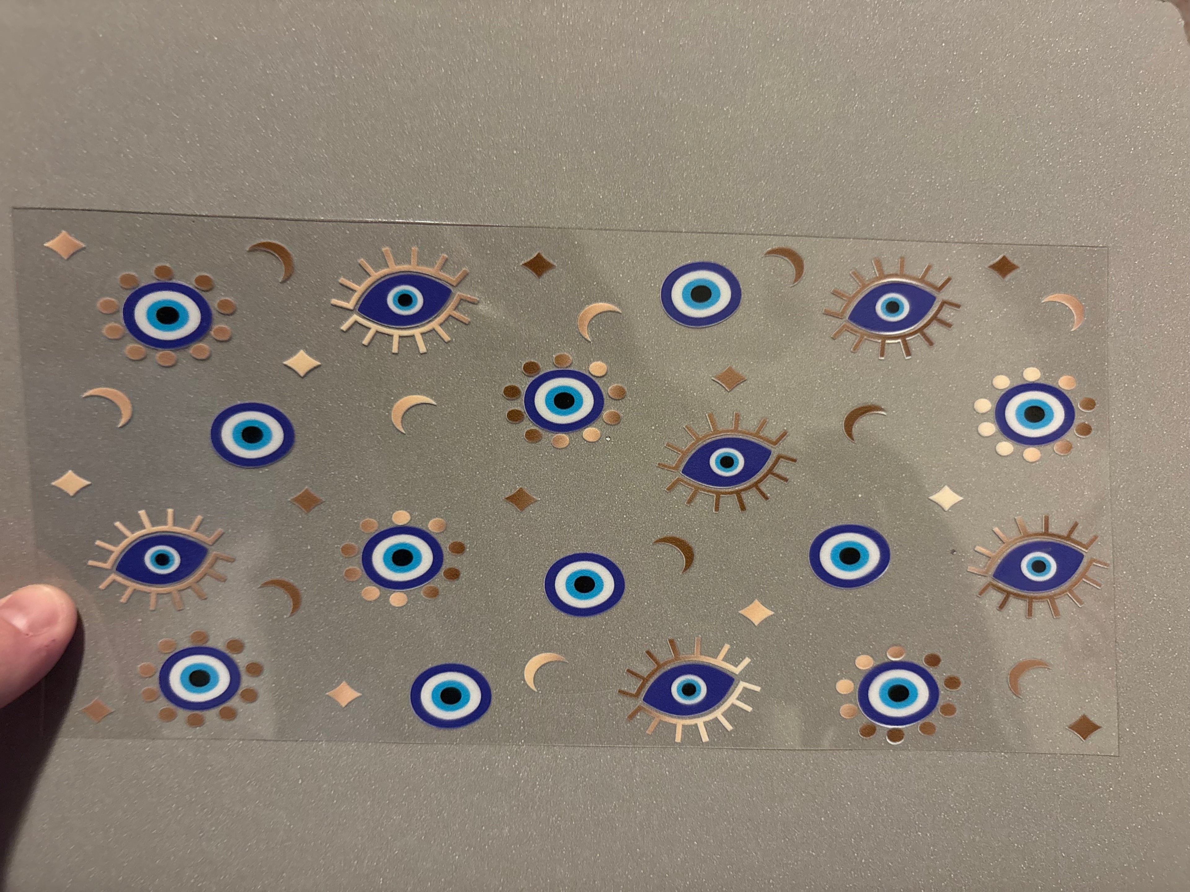 Small evil eye, gold moons