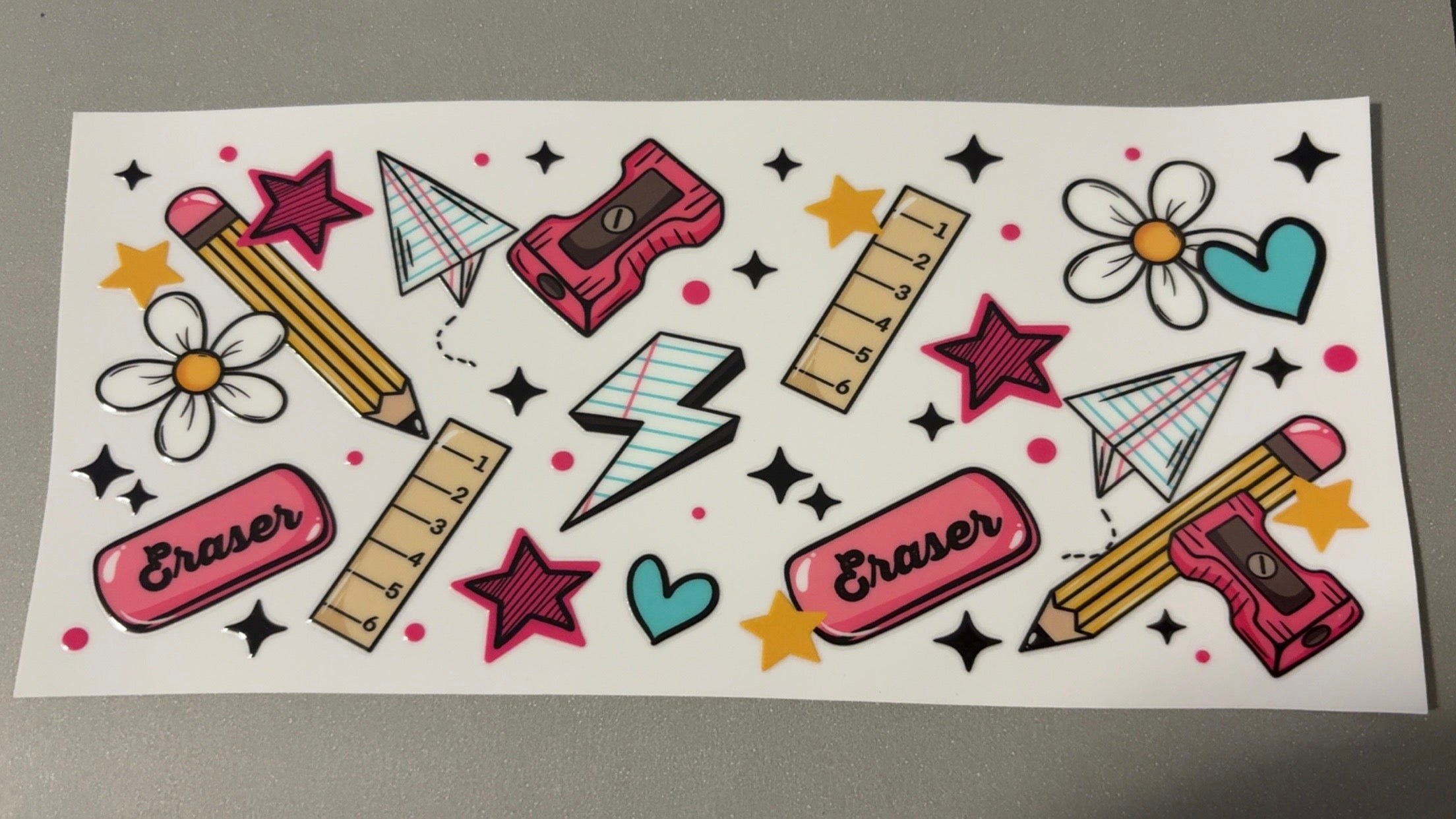 Erasers, rulers, pencil sharpeners, hearts, stars, flowers