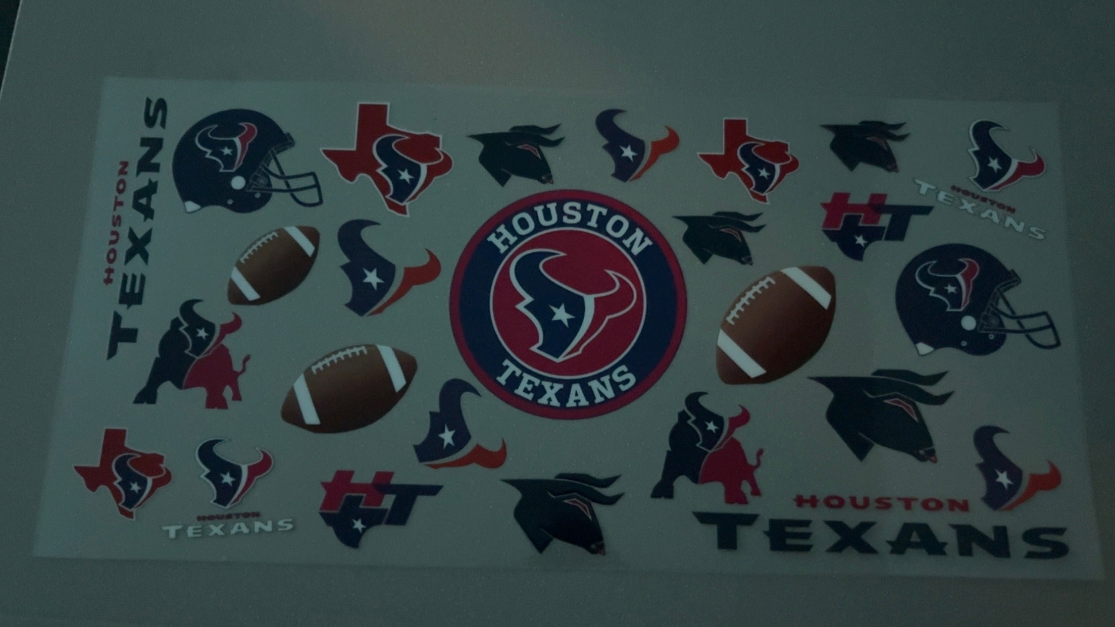 Houston Texans with logos, helmets & footballs