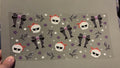 Skull heads with orange bows, purple stars, skullhead bows, white sparkles
