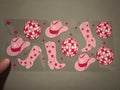 Pink disco balls, pink cowboy hats, pink boots with stars, pink stars