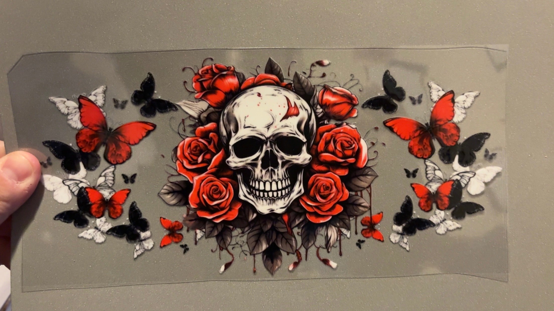 Skull with roses with red,white & black butterflies