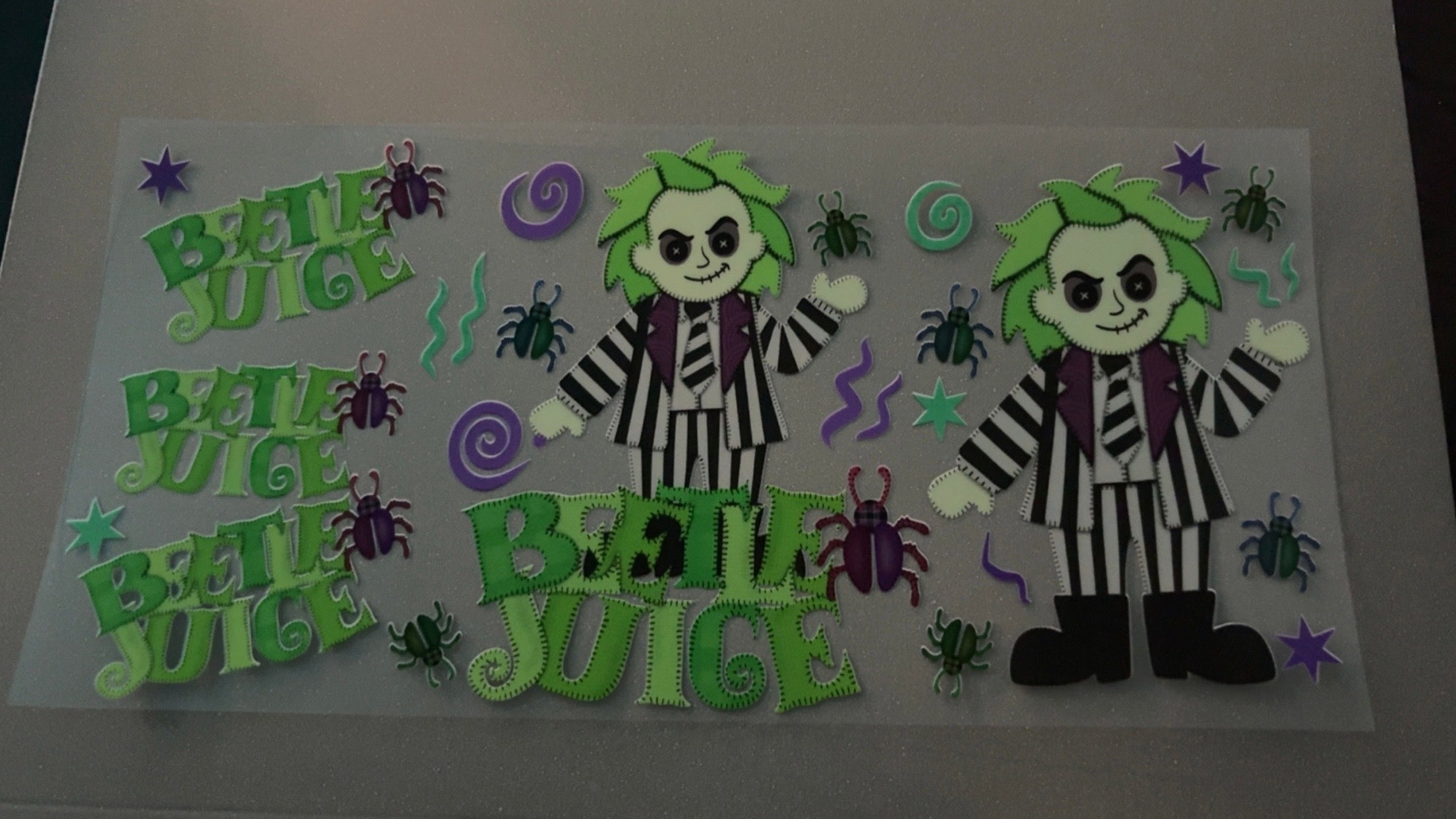 Stitched Beetlejuice, bugs, purple swirls