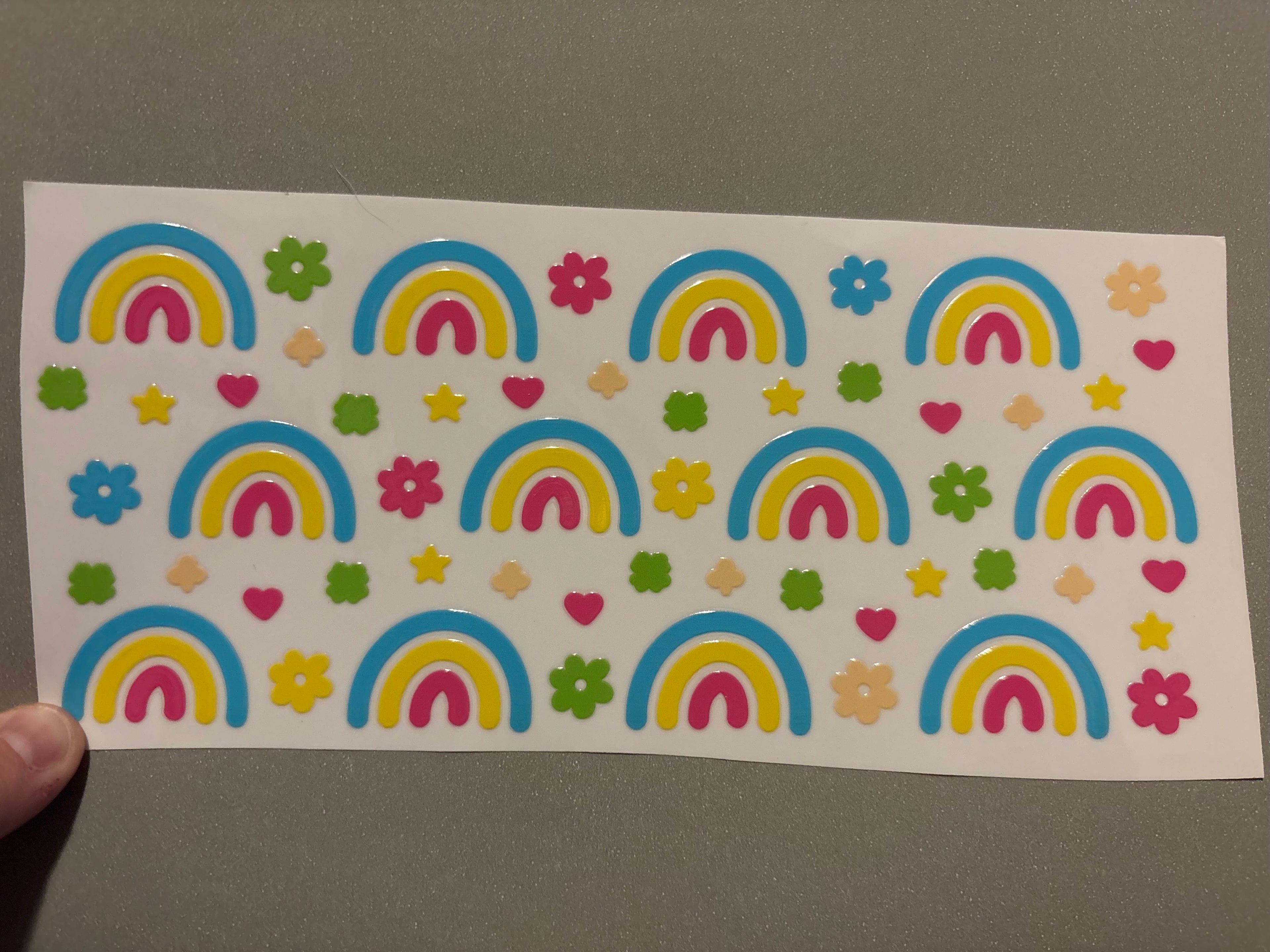 Rainbows, green, pink, yellow & blue flowers, stars & hearts