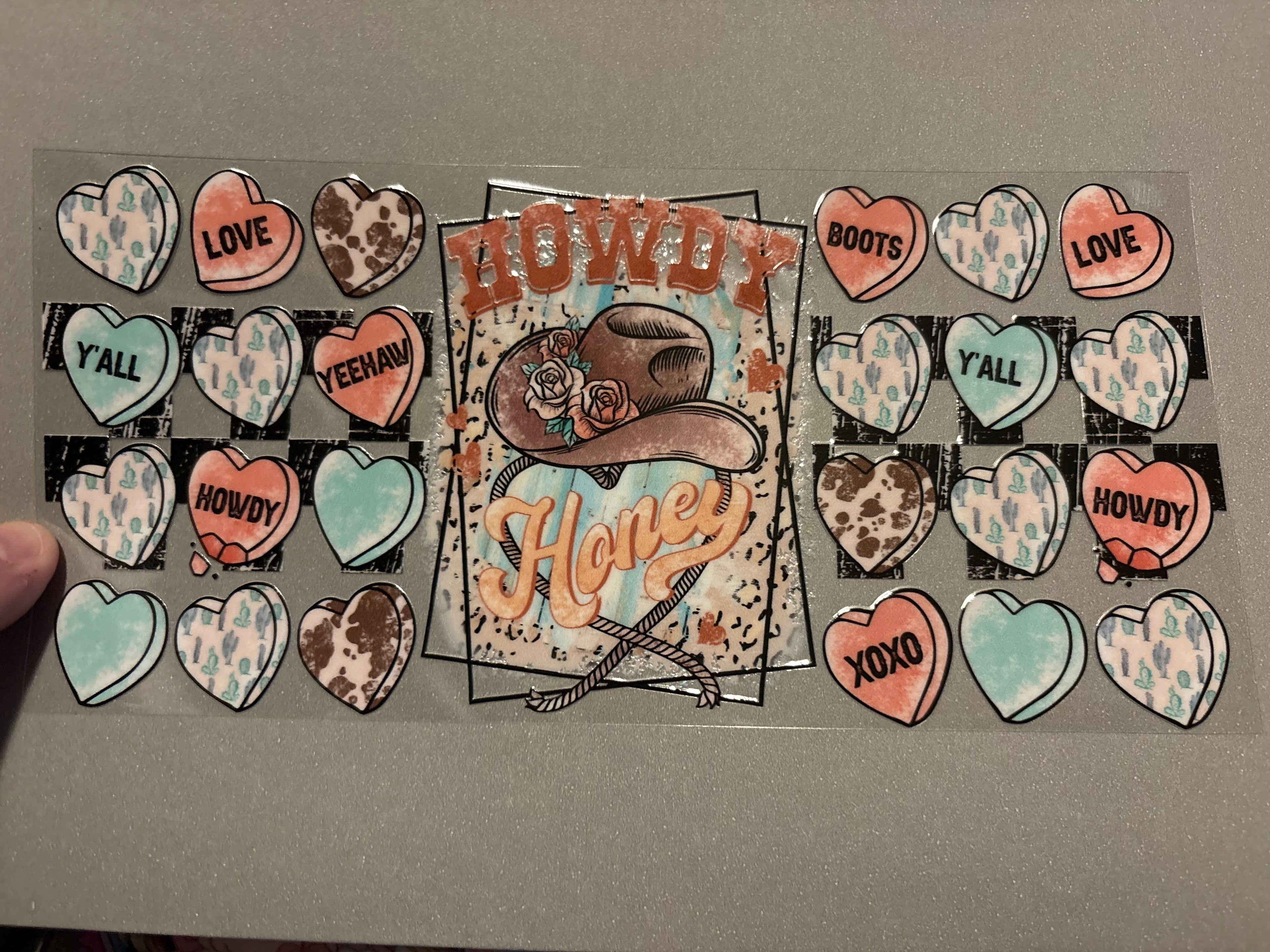 Howdy Honey, cowboy hate with flowers, heart background