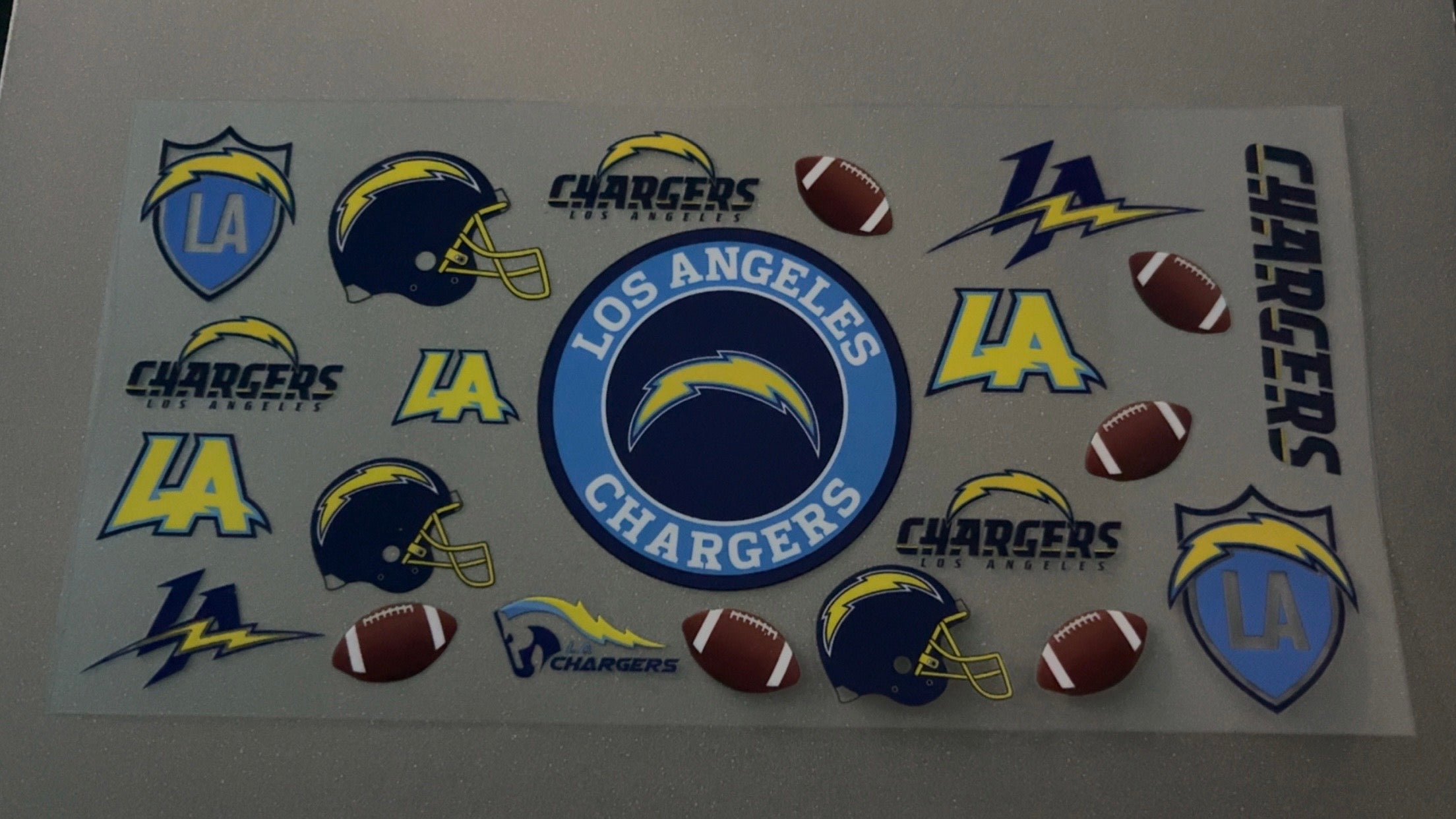 Los Angeles Chargers with footballs & logo's