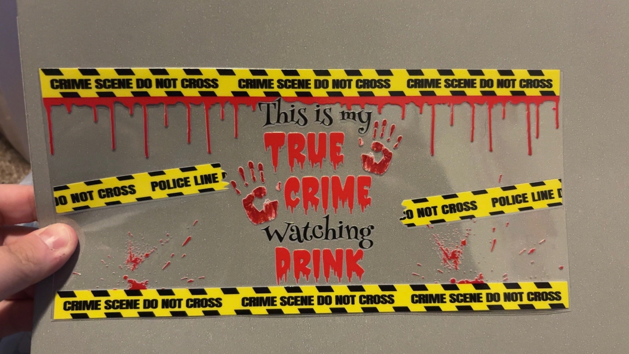 True crime watching drink, caution tape, blood drip