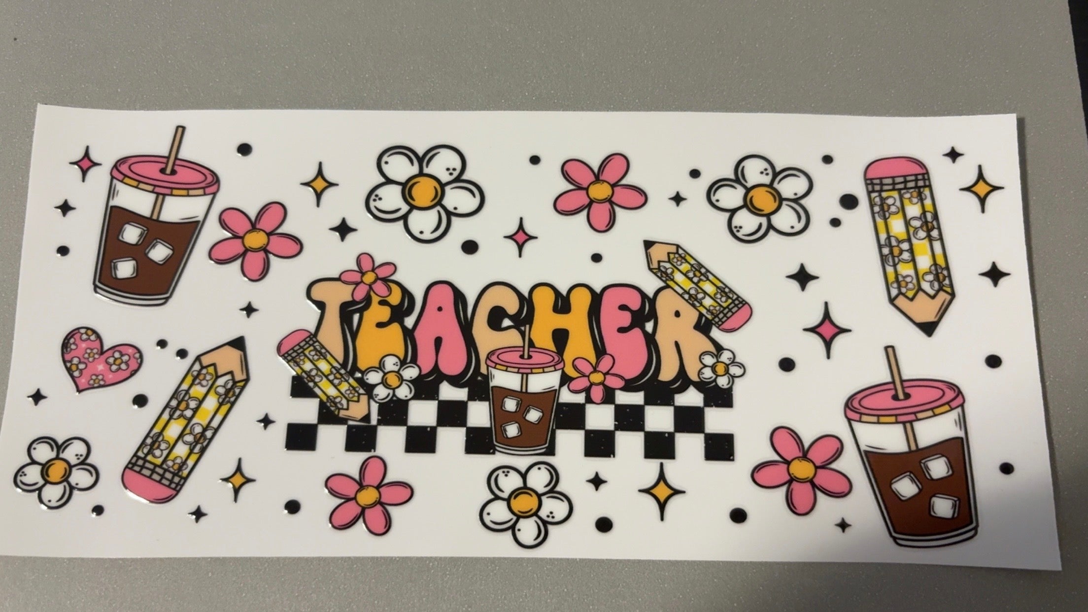 Teacher, flowered pencils, coffee, flowers