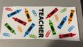 Teacher, crayons & paperclips