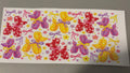 Red, purple, yellow balloon dogs, bows & stars