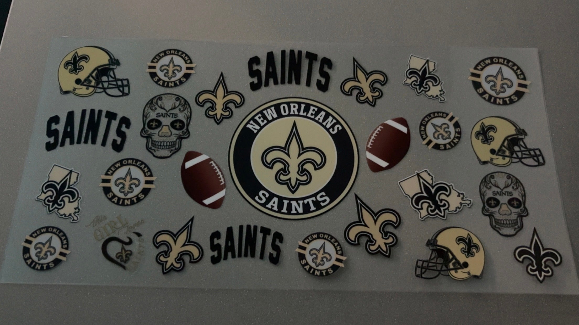 New Orleans Saints with helmets & footballs