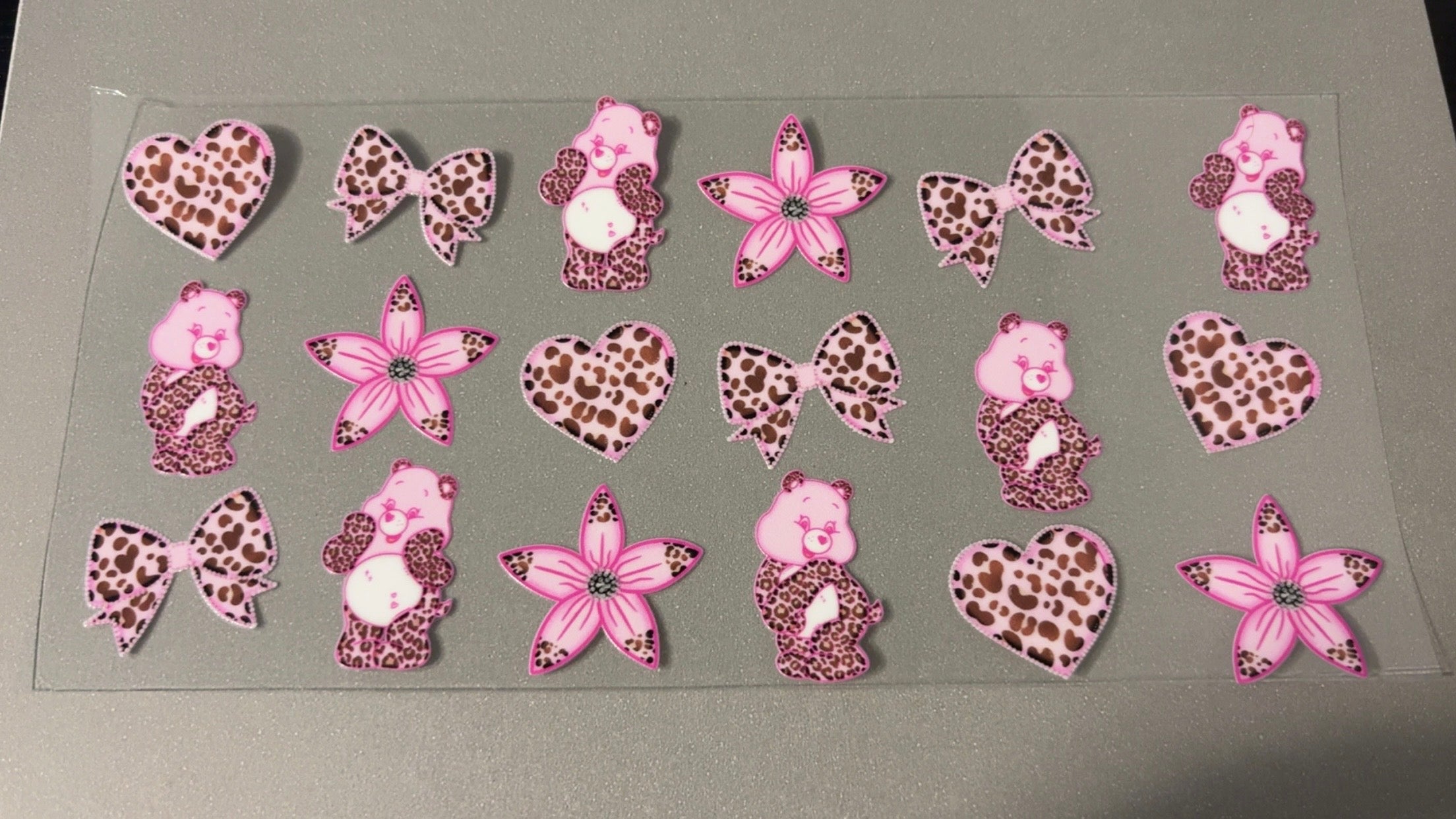 Pink Cheetah bows, flowers & carebears