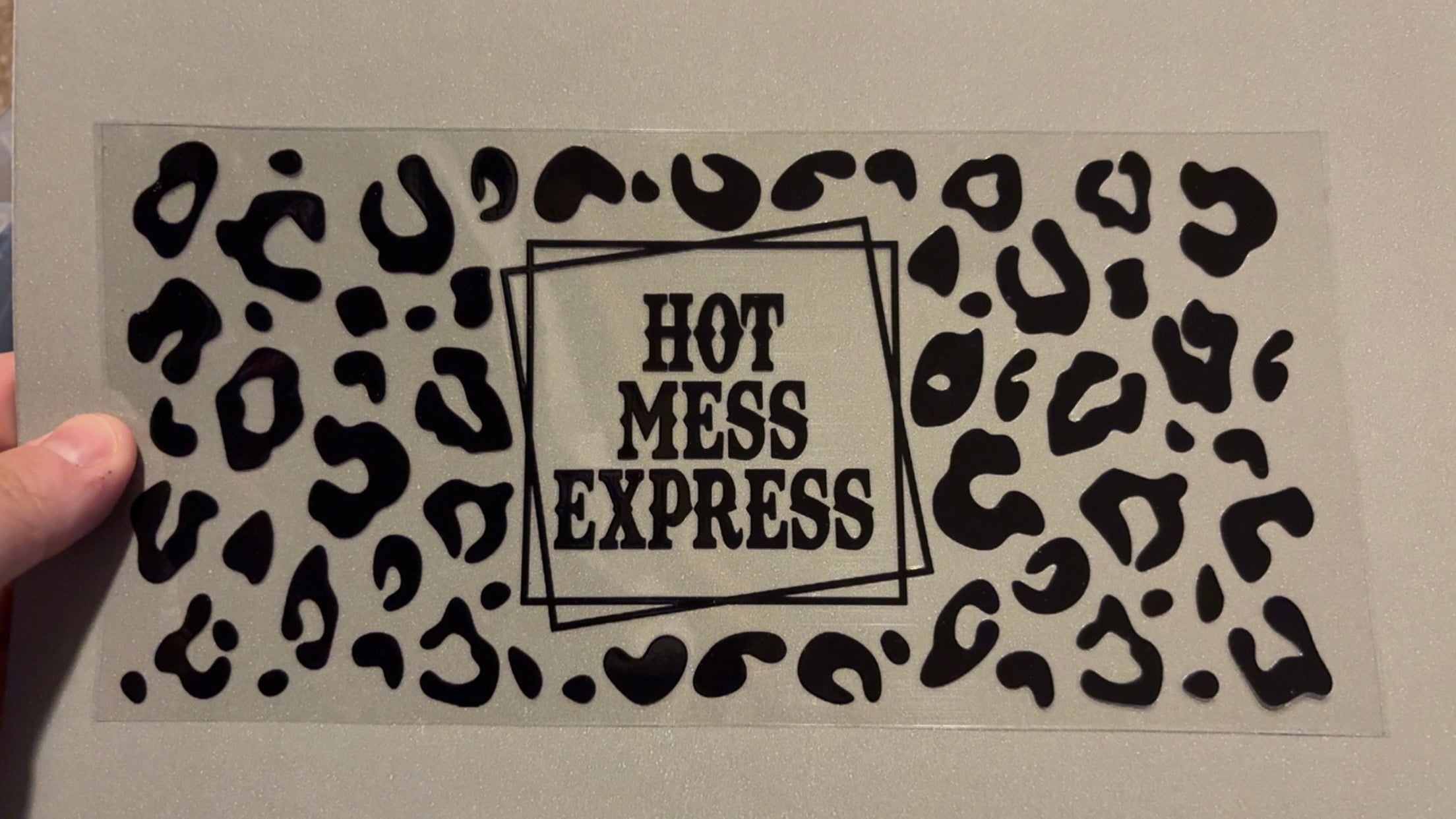Hot mess express, black cheetah print background