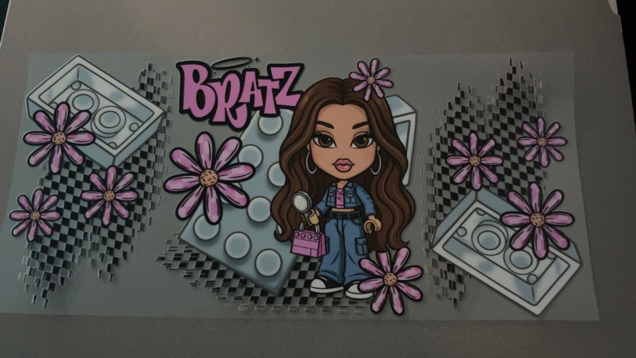 Brunette Bratz doll with lego's, pink flowers