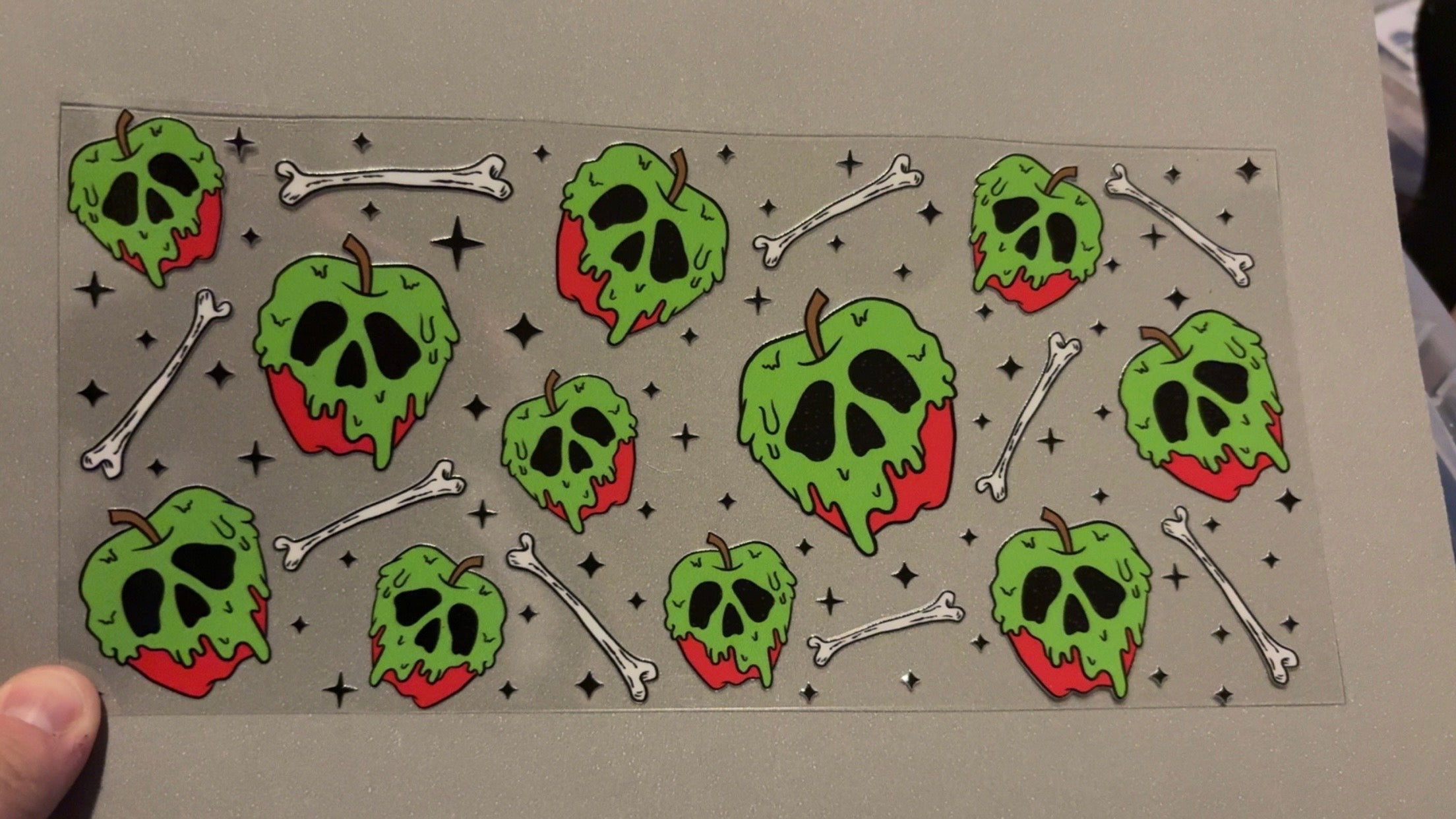 Green slime covered apples, bones, black sparkles