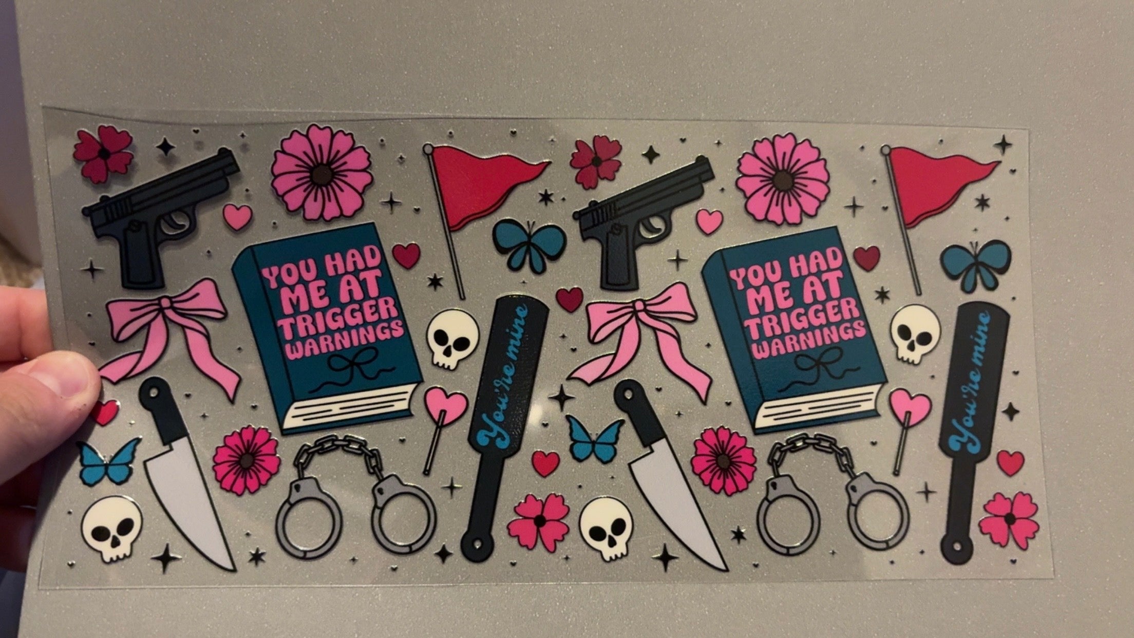 Trigger warnings with guns, knives, handcuffs