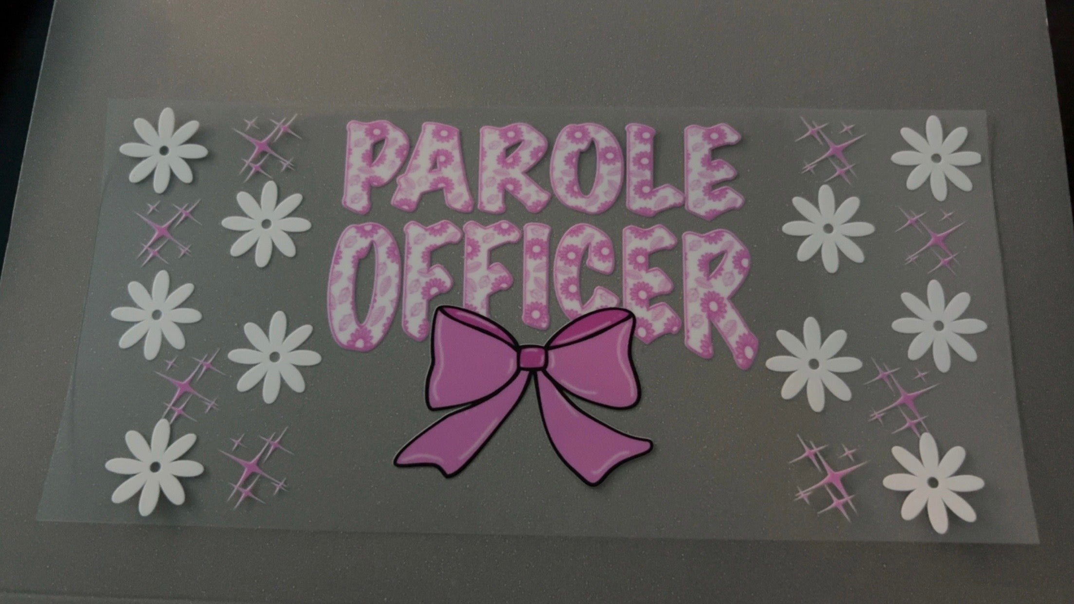 Parole Officer, pink bow, white flowers, pink sparkles