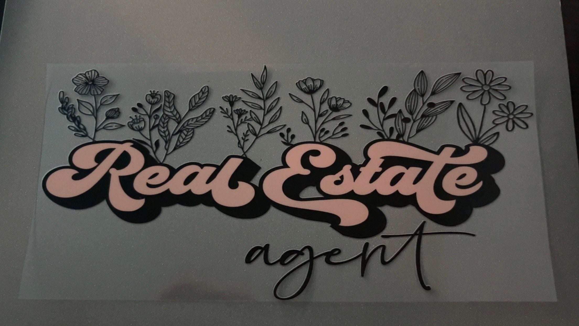Peach Real Estate Agent with flowers