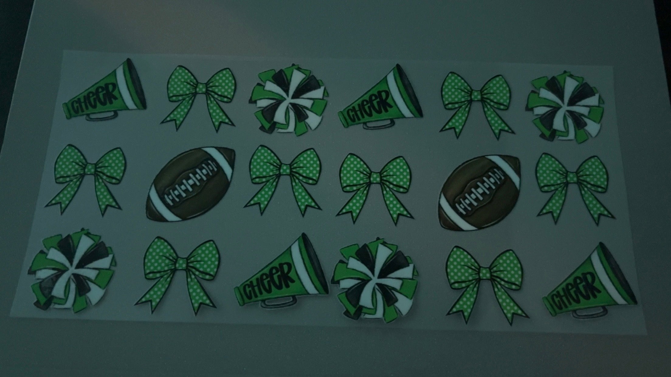 Green cheer pompoms, green bows & footballs