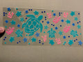 Turtles, pink coral, blue stars, blue bubbles