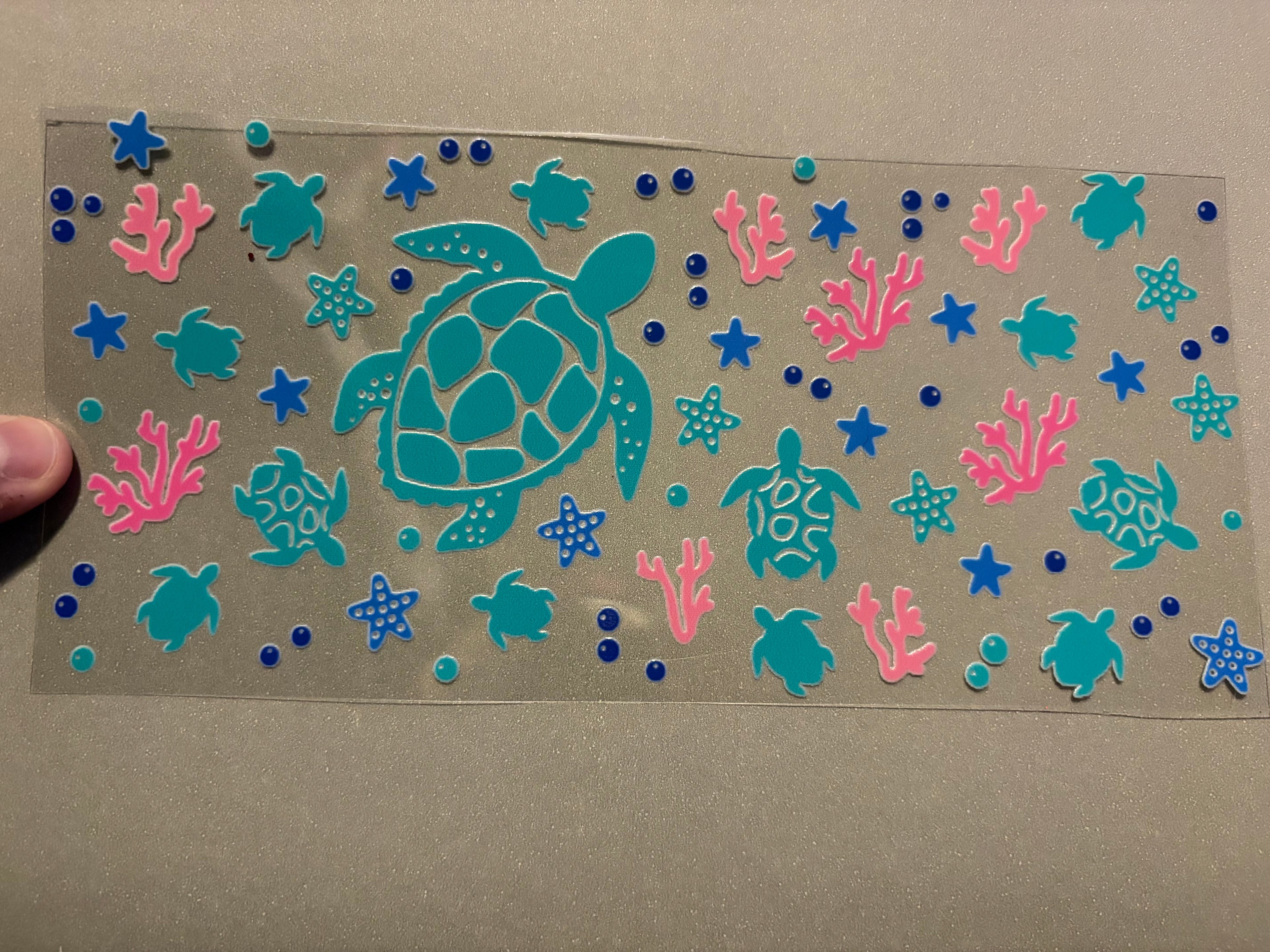 Turtles, pink coral, blue stars, blue bubbles