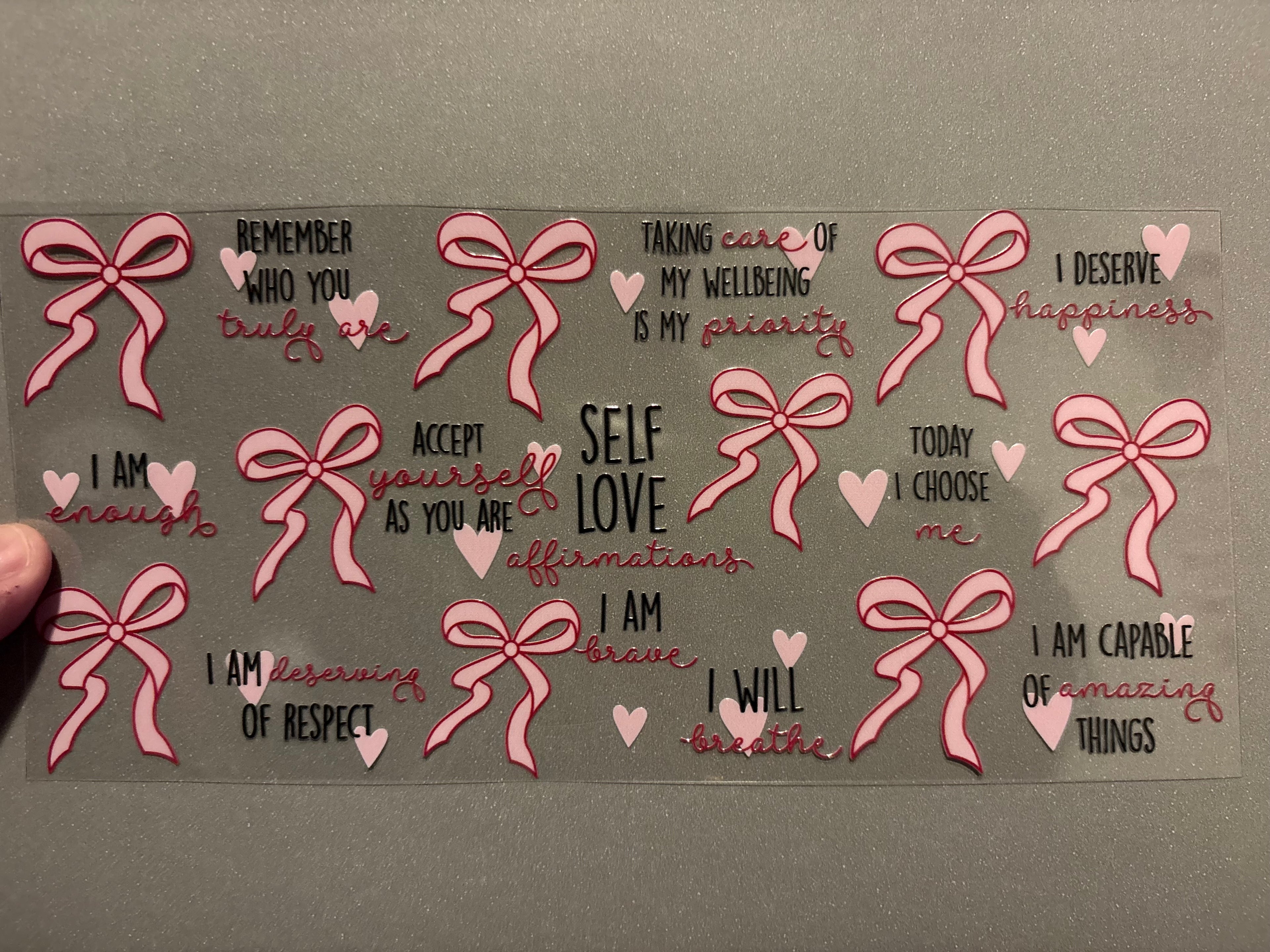 Self Love Affirmations with pink ribbons, pink hearts